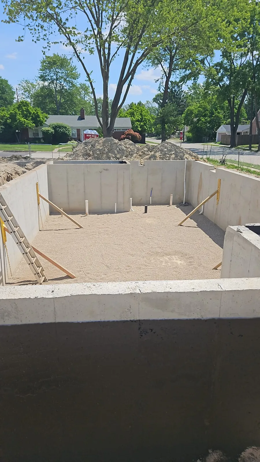 Poured concrete foundation walls ready for floor framing