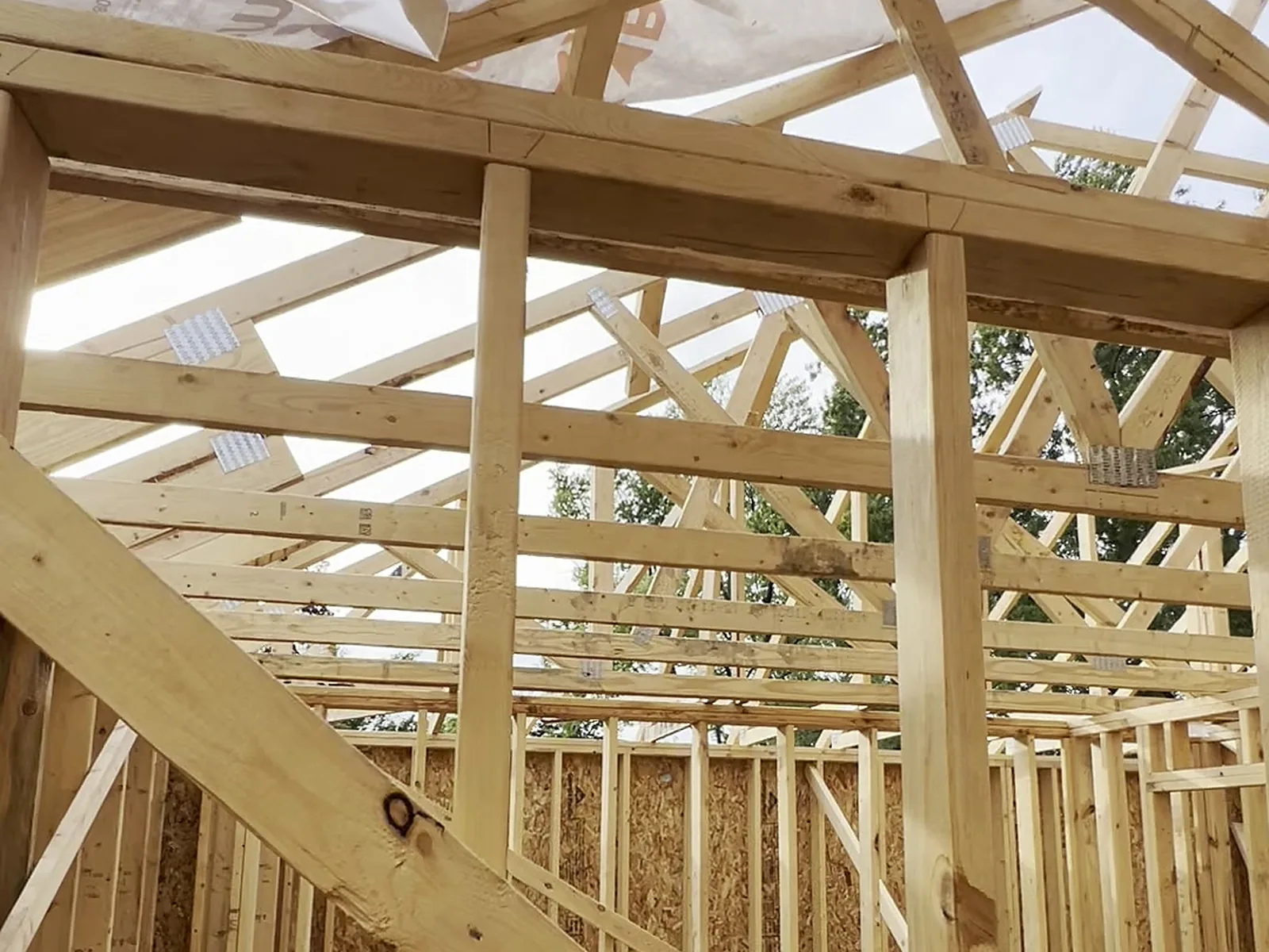 LVL beam and roof trusses over interior partitions, custom home, Novi MI